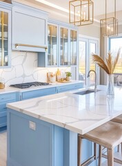 Light blue kitchen island with quartz countertop, glass-front cabinets, and gold accents.