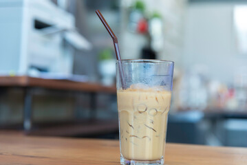 Iced coffee on wooden counter bar