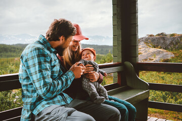 Family father mother and baby sitting on terrace parents with infant child happiness candid emotions bonding moments together, summer vacations lifestyle