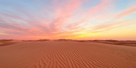 Naklejka premium A serene desert landscape at sunset, featuring soft sand dunes and vibrant, colorful skies blending hues of pink and orange.