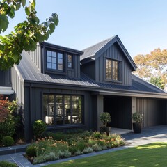 Dark Modern Farmhouse: Exterior View of a Stylish Home with Metal Roof and Landscaped Garden on a Sunny Day
