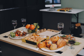 Asian office colleagues and friends enjoy a daytime BBQ with pizza and beer, celebrating Halloween and cheering for their favorite soccer team, creating a lively atmosphere filled with joy.