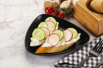 Bruschetta with soft cheese and radishes