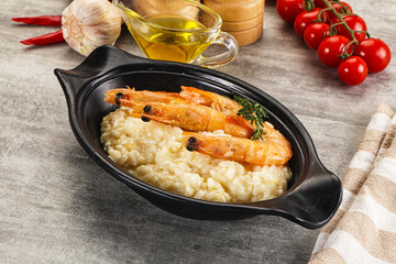 Italian risotto with prawn served thyme