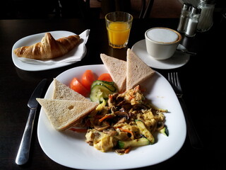 Breakfast & Brunch with vegetabes, toast, croissont, coffee and fresh orange juice. 