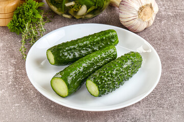 Homemade lighty salted cucumbers with herbs
