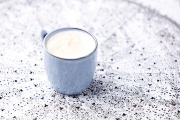 Cappuccino on bright background. Soft focus. Copy space.