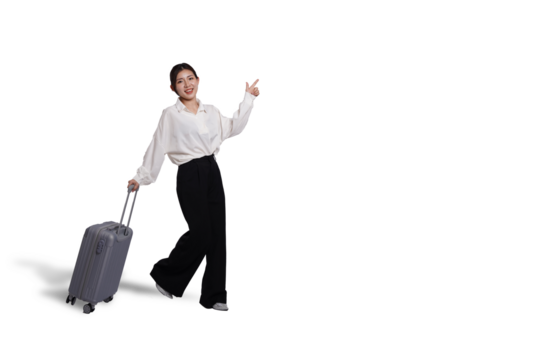 Cheerful young Asian woman holding suitcase with walking to the front, isolated on white background. Concept tourist holiday trip, cut out