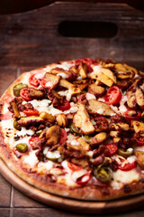 Gyros Pizza with jalapeno pepper, cherry tomatoes and mozzarella cheese. Soft focus. Close up.
