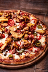 Gyros Pizza with jalapeno pepper, cherry tomatoes and mozzarella cheese. Soft focus. Close up.