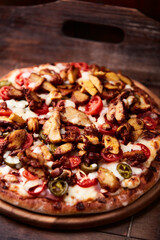 Gyros Pizza with jalapeno pepper, cherry tomatoes and mozzarella cheese. Soft focus. Close up.