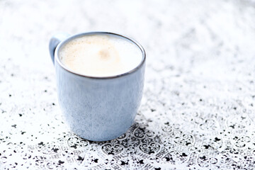 Cappuccino on bright background. Soft focus. Copy space.