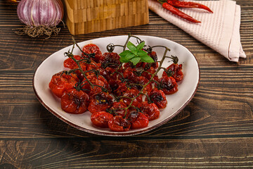 Baked cheeryy momatoes with olive oil