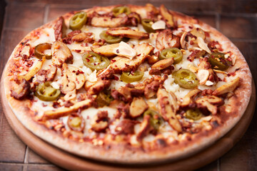 Gyros Pizza with with champignons and mozzarella cheese. Wooden background. Soft focus.	