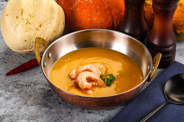 Pumpkin cream soup with prawns