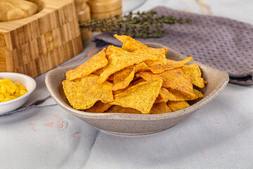 Corn nachos chips with cheese dip