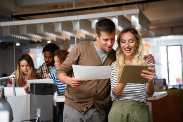 Startup business team on meeting in modern bright office interior and working together