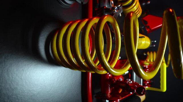 tuned new parts spare parts for the front suspension of a front-wheel drive car ball silent blocks coilovers yellow and a jack with stands