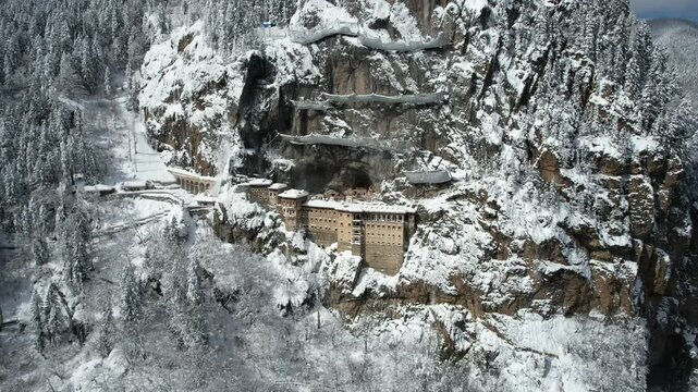 Sumela Monastery, a historic monastery built on the rock, snow-covered view of a monastery, Turkey