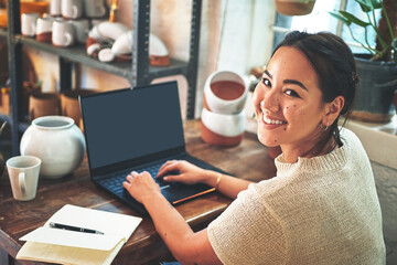 Laptop, portrait and ceramic with woman in studio for pottery inventory, clay and space. Small...