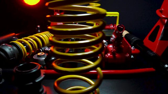 tuned new parts spare parts for the front suspension of a front-wheel drive car ball silent blocks coilovers yellow and a jack with stands