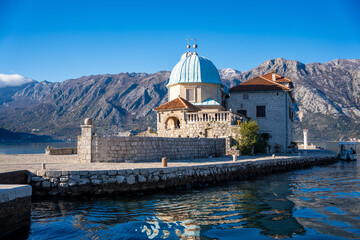 Naklejka premium Saint George Island and Church of Our Lady of the Rocks near Perast in Montenegro. Boka Kotor bay, Europe. 