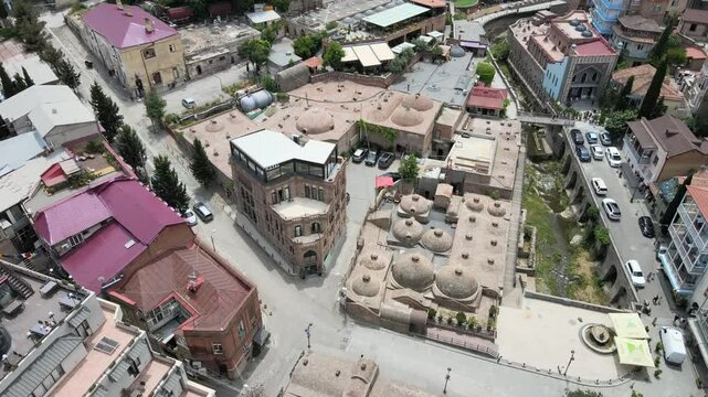 Aerial video above Tbilisi city on a sunny day