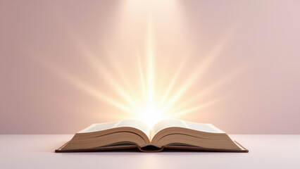 Open Bible on a white surface with light beams emanating from its pages, symbolizing spirituality or divine guidance.