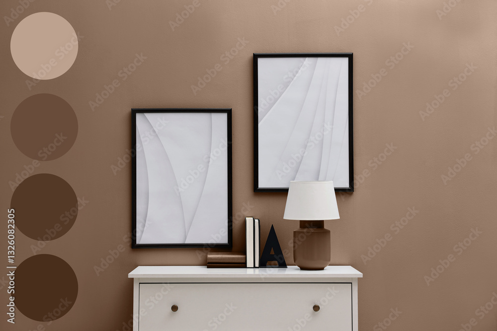 Poster console table with lamp and books near wall in mocha mousse shade. interior design with matching col