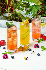 Summer refreshing bright cocktails with ice, restaurant. Vertical frame.