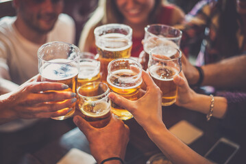 Group of teens having fun in a pub