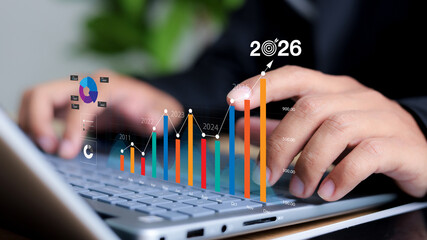 Businessman plan strategy marketing and finance to goal in 2026 planning business growth with...
