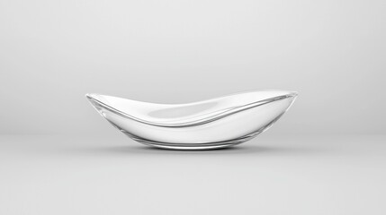 A transparent glass bowl with a smooth, curved shape sits on a gray background.