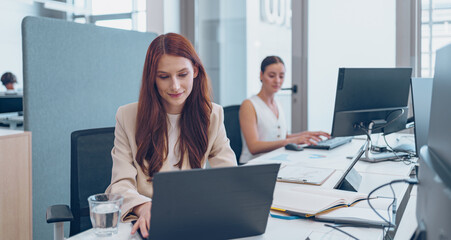 Professional Women Actively Engaging in a Dynamic and Modern Office Environment of Today