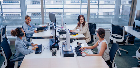 Modern offices feature engaged teams collaborating on projects to achieve collective goals