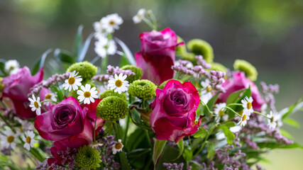 Beautiful bouquet of flowers with roses and chamomilla