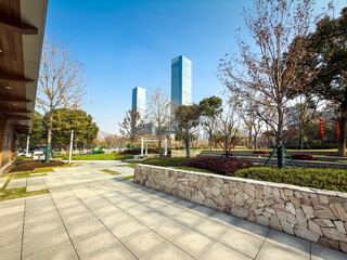 Serene Urban Park with Modern Skyline and Lush Greenery