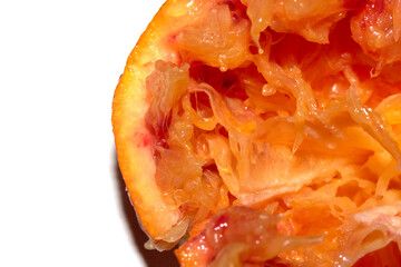 Blood Red Orange Slice Piece Fruit Cut Squeezed Crushed and Used Close up on White Background