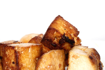 Tasty Cubes Chunks of Tofu Soy Pieces Vegan Fried Golden Cooked Close up on White Background