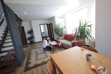 Mother and a boy spending time together playing indoors