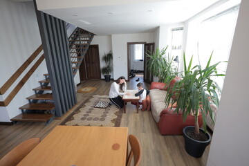Mother and a boy spending time together playing indoors