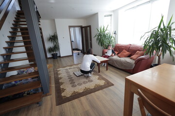 Mother and a boy spending time together playing indoors