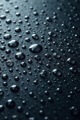 Numerous tiny water beads on a dark gray surface, numerous, high resolution, pattern