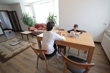 Mother and a boy spending time together playing indoors