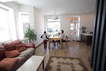 Mother and a boy spending time together playing indoors