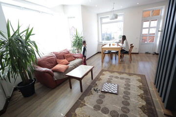 Mother and a boy spending time together playing indoors