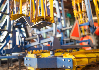 Farm equipment stored in a shed.