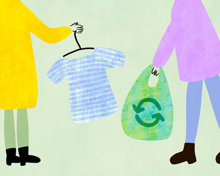 Two people shopping recycling second hand clothing