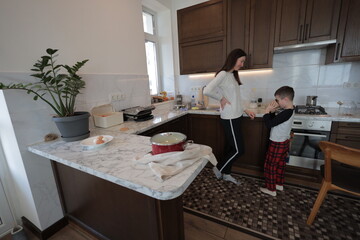 Mother and a boy spending time together playing indoors