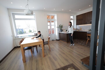 Mother and a boy spending time together playing indoors
